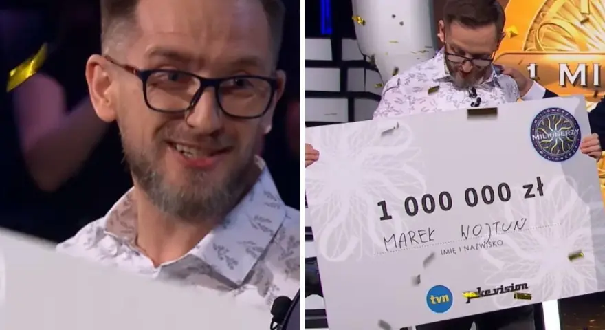 Marek Wojtun, milionerzy kto wygrał milion, trzyma gigantyczny czek na 1 000 000 zł.